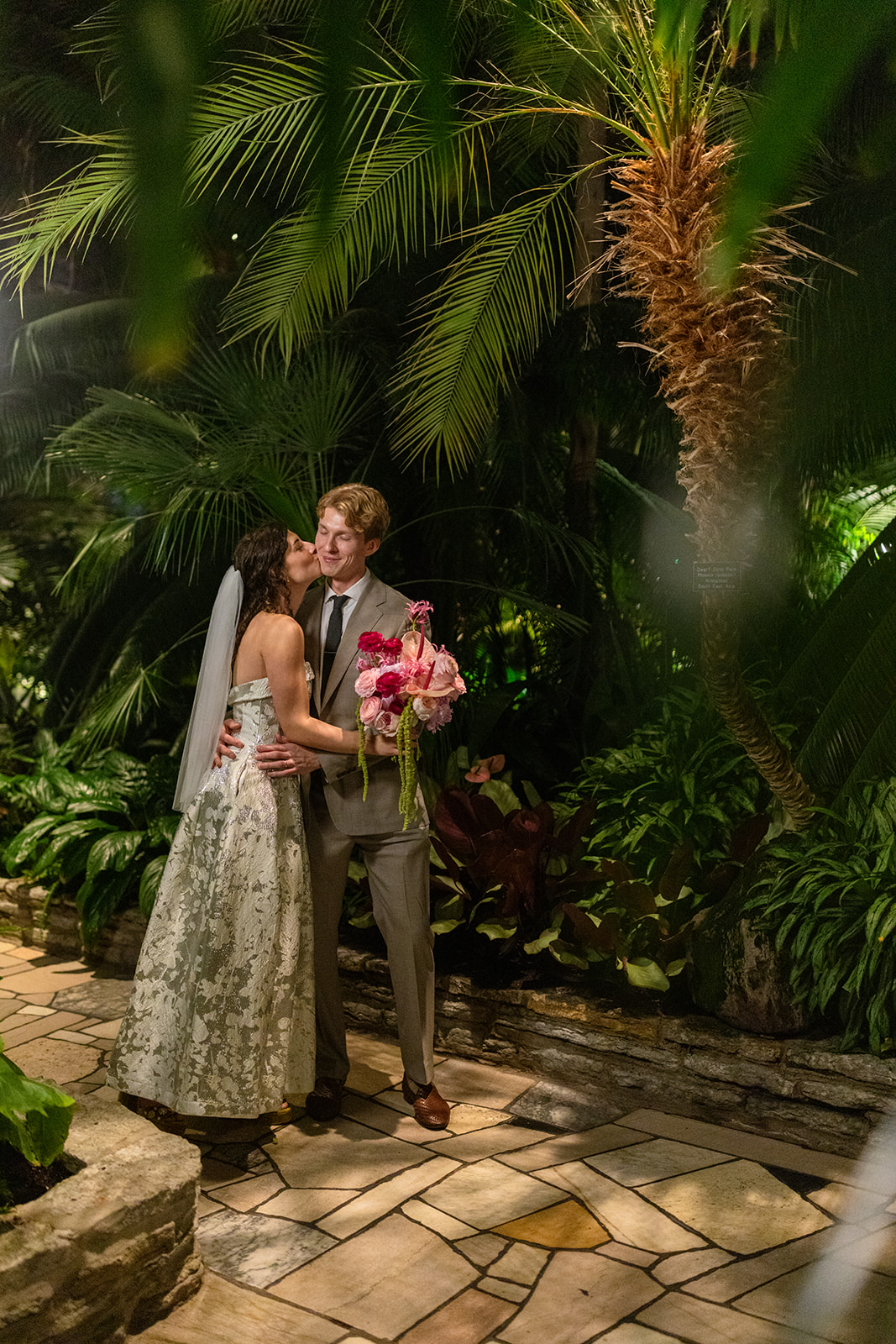 Couple exchanging vows in the Sunken Garden at Como Park Conservatory, St. Paul